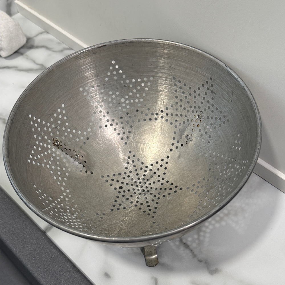 vintage aluminum colander featuring 7 star
